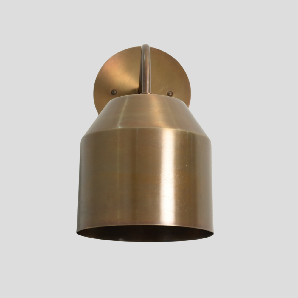Focus on the brass finish of this minimalist wall sconce, handmade light designed by LightCove 