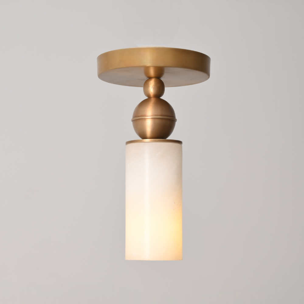 Alabaster cylinder flush mount ceiling light with brushed brass metal base