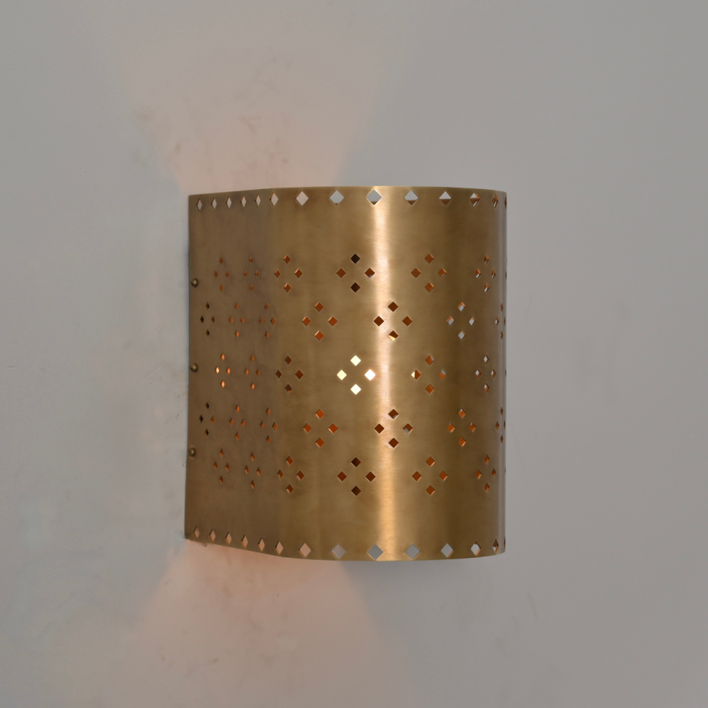Modern brass wall lamp with perforated metal shade