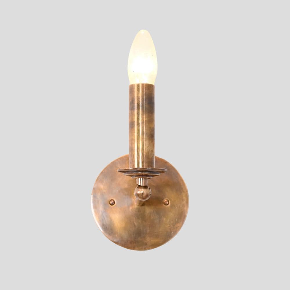 Handmade wall light designed by lightcove with a pure antique brass finish 