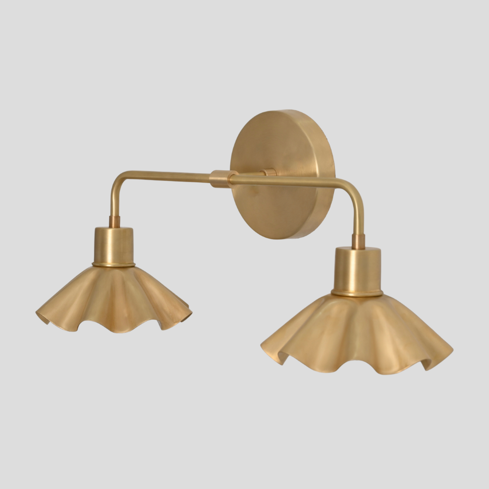 Vintage brass wall sconce a minimalist vanity light on a gray background