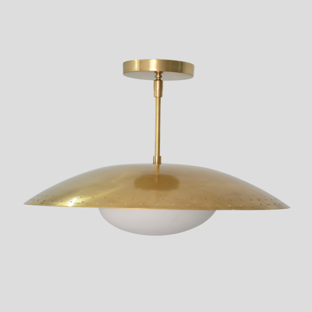 Perforated Brass Dome Ceiling Light - Glass Globe Pendant with perforated dome shade, white glass globe, brass cylindrical stem, circular brass canopy, and mid-century modern design.