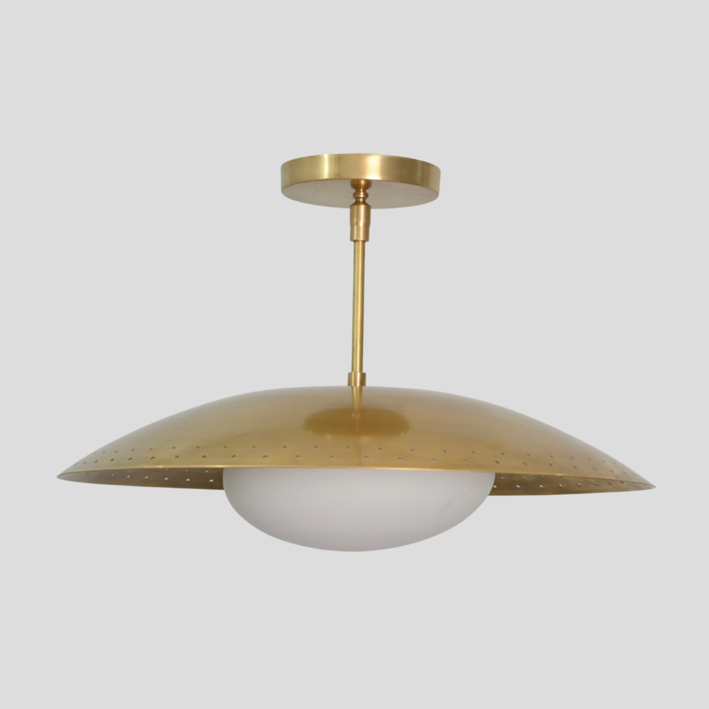 Perforated Brass Dome Ceiling Light - Glass Globe Pendant with perforated dome shade, white glass globe, brass cylindrical stem, circular brass canopy, and mid-century modern design.
