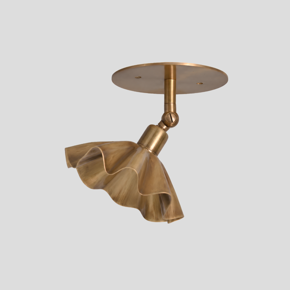 Ruffled Brass Flower Spot Light - Adjustable Ceiling Light with sculptural fluted trumpet shade, articulating brass arm, swivel joint connector, and circular brass ceiling canopy.