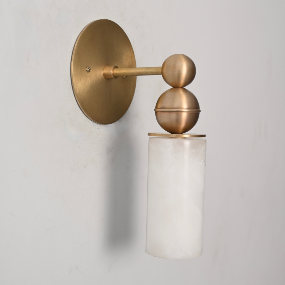Single alabaster wall sconce in solid brass with cylindrical stone shade