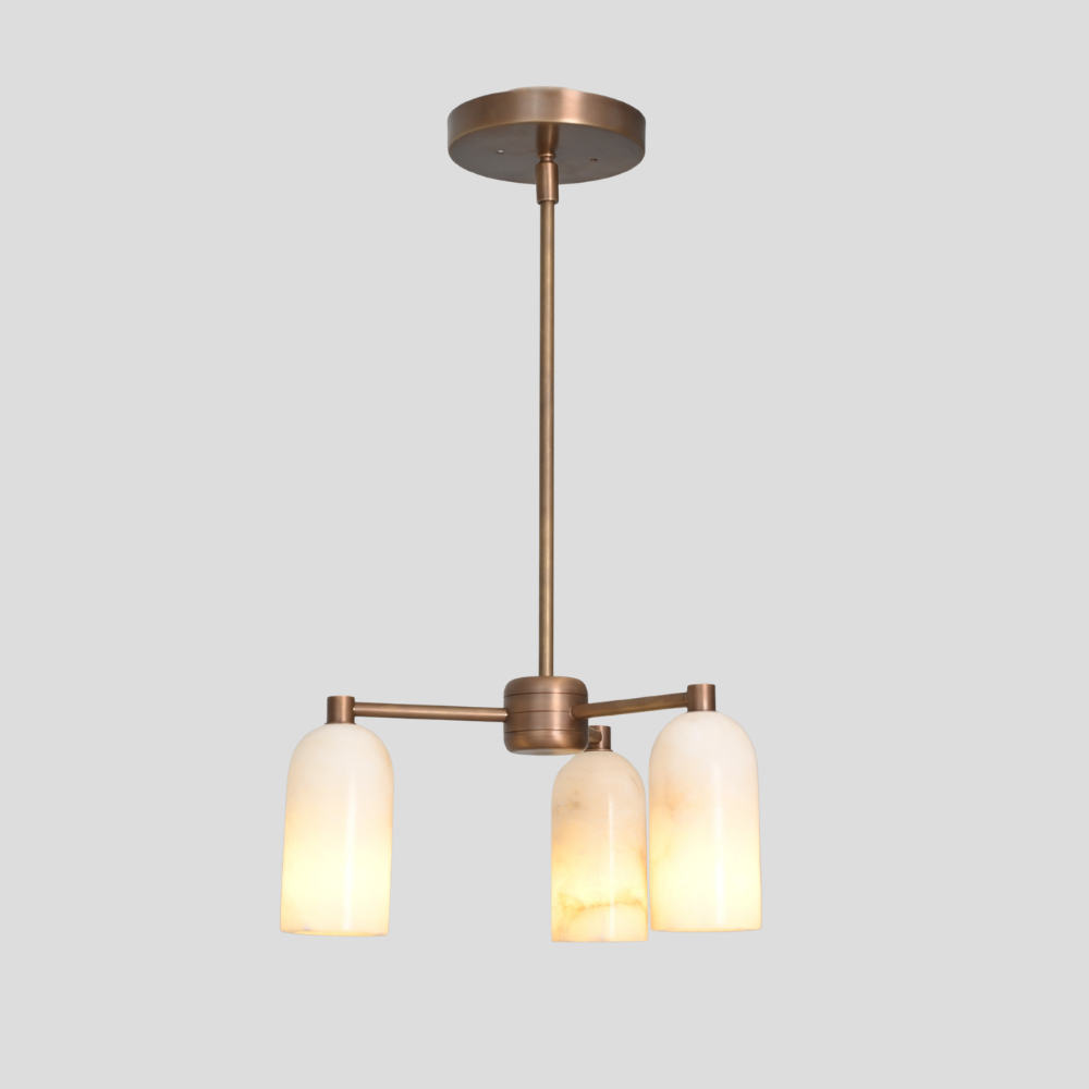 Modern pendant light with three alabaster shades on a gray background