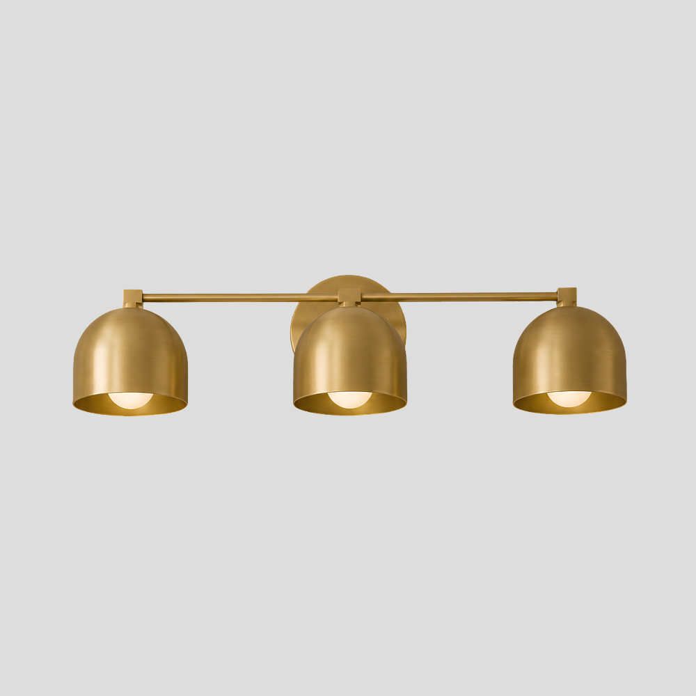 Triple Brass Dome Sconce - Mid Century Linear Arm Vanity Light with three hemispherical shades, horizontal rod, circular backplate mount, and contemporary bathroom lighting design.