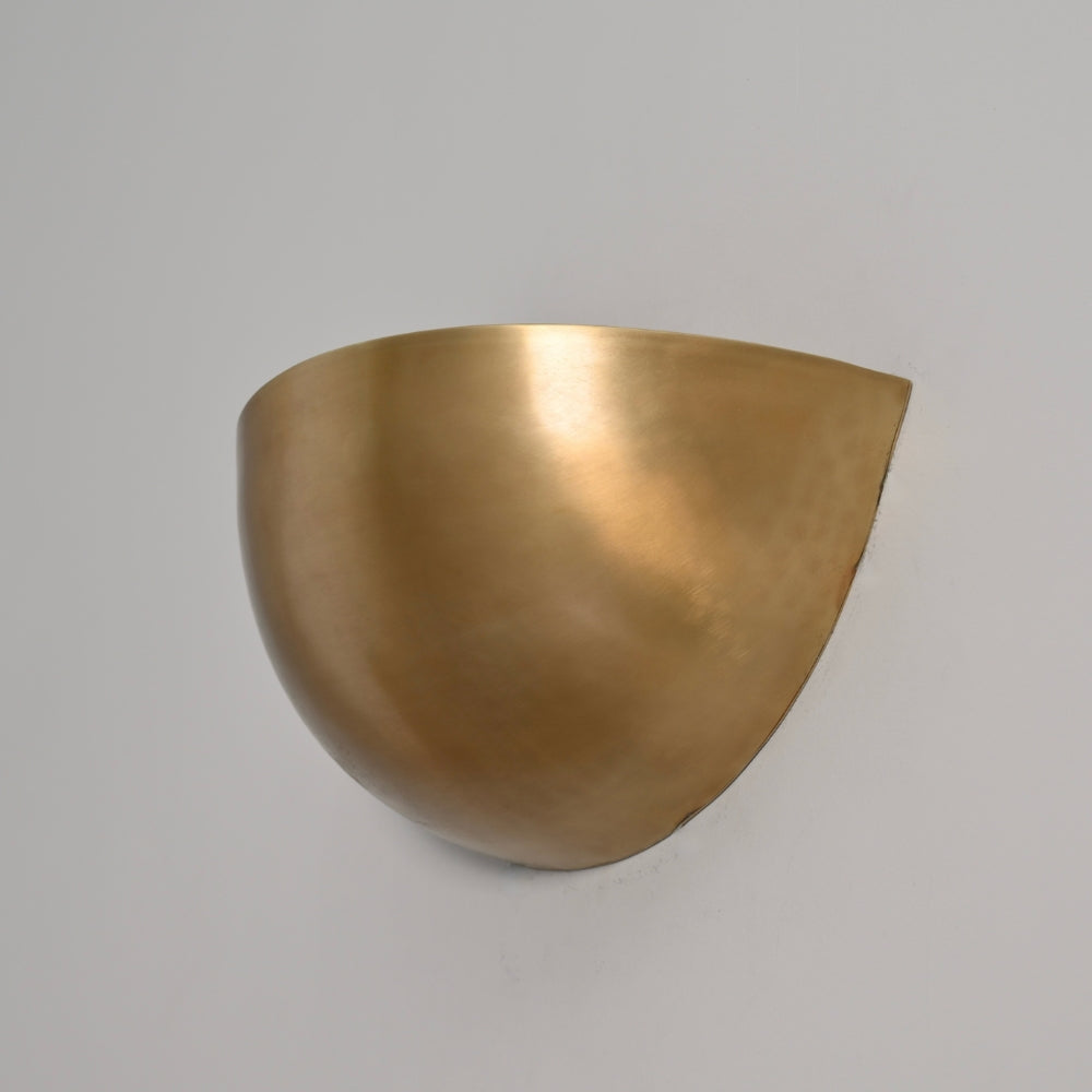 Bronze wall sconce on a gray background