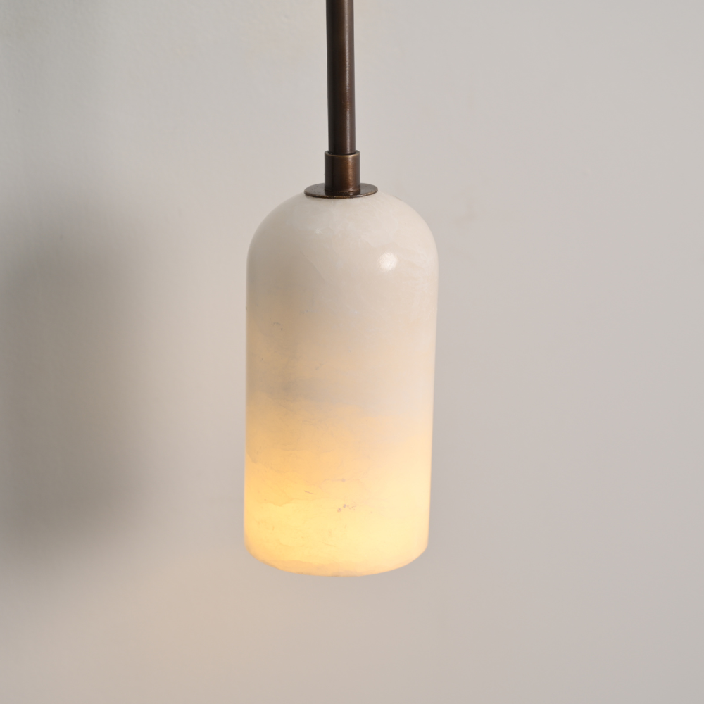 Close up on the marble shade of an handmade alabaster wall lamp