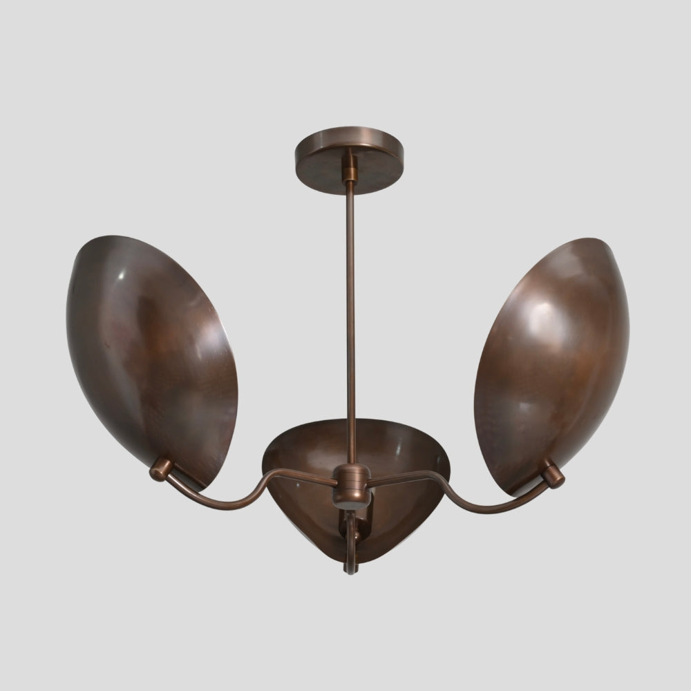 Bronze chandelier with three oval-shaped lampshades on a gray background
