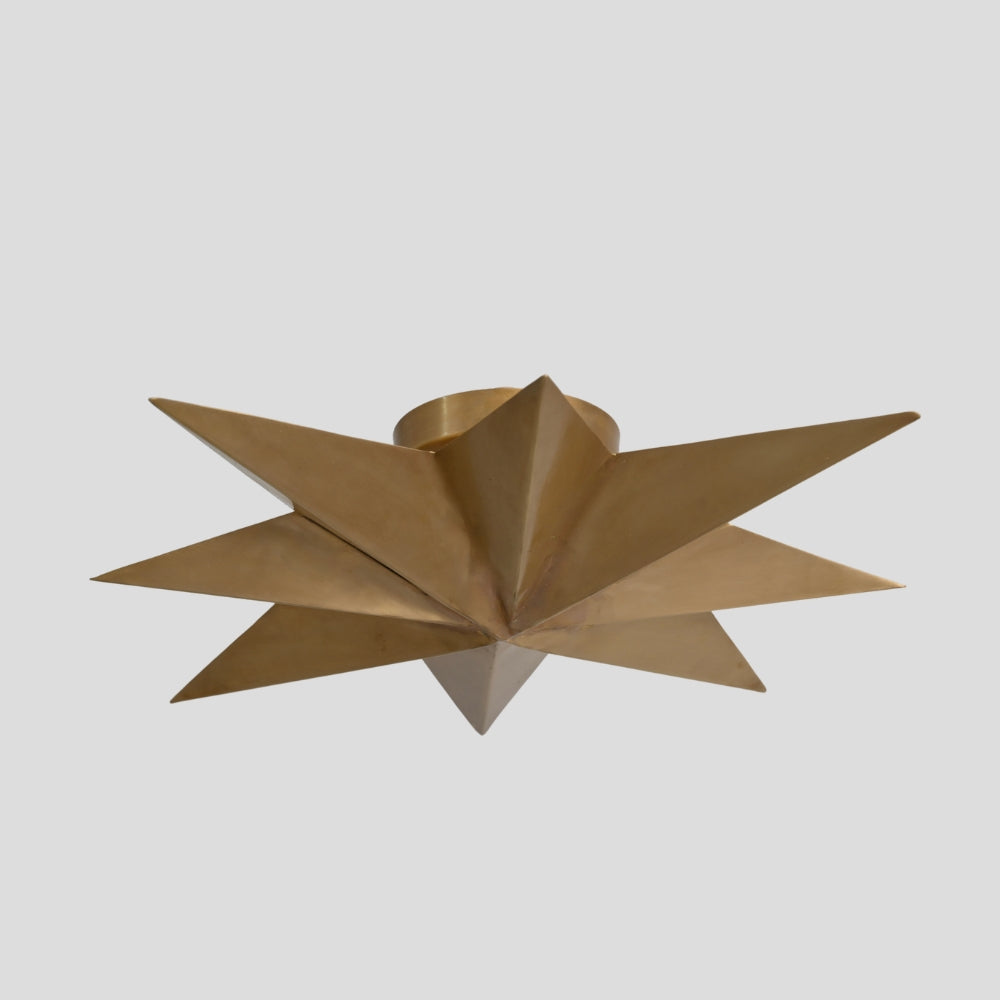 sculptural brass starburst ceiling light modern interior